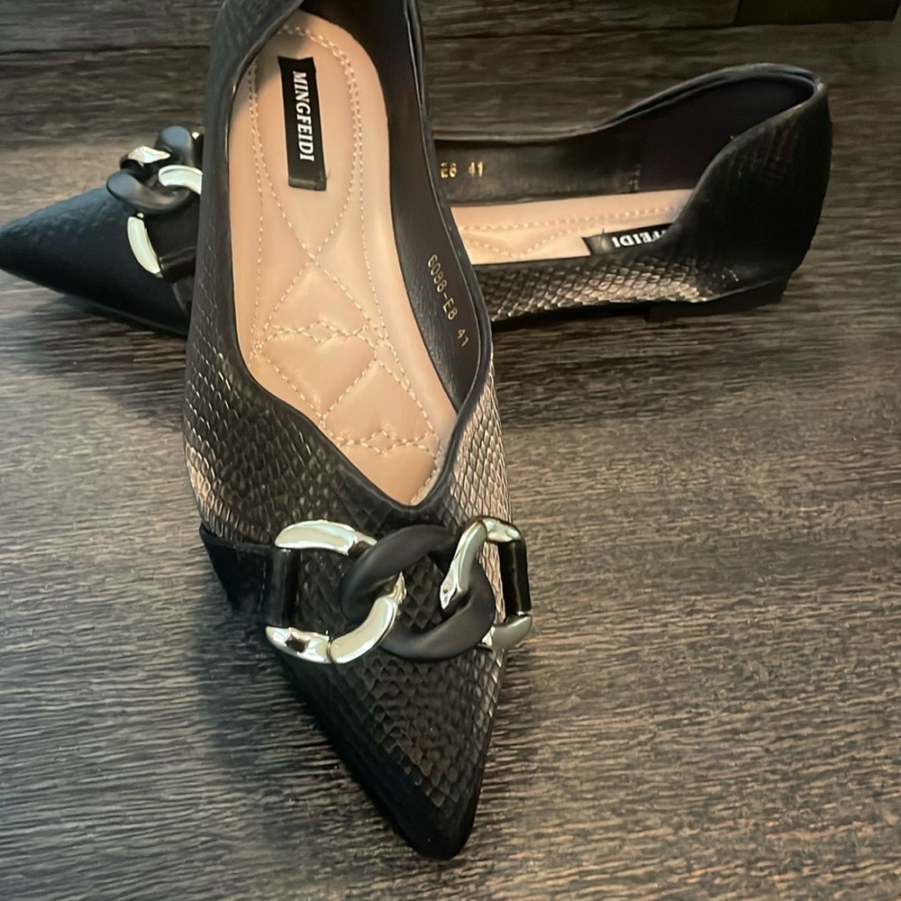 Black flats with buckle detail
